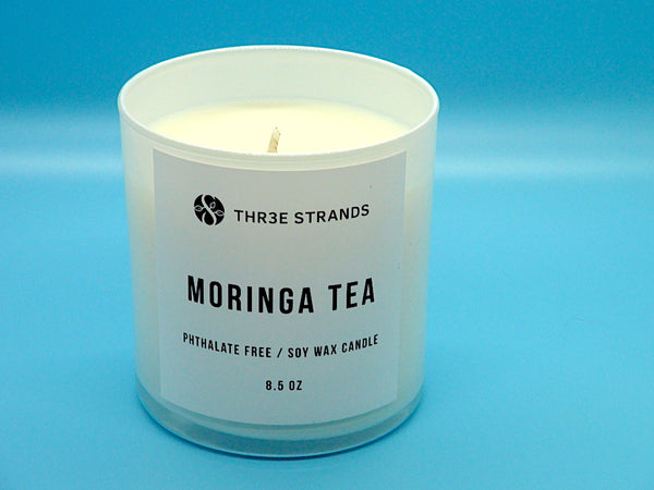 Moringa Tea Candle: 8.5 oz.  Aromas of lemon peel and light florals.   Ingredients: Soy Wax, Fragrance Oils. [Phthalate Free]